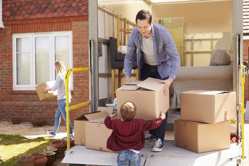 Office removals planning in West Hampstead with moving boxes and business equipment