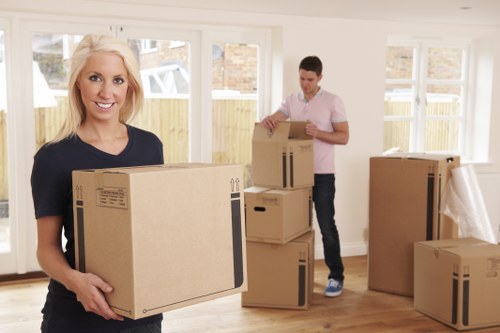 Home moving service in West Hampstead with packed boxes and removal van