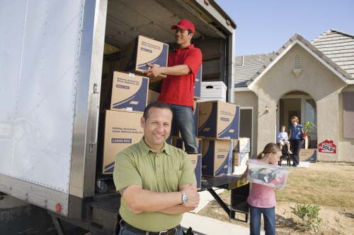 Packed moving boxes and furniture ready for transport in a local removal service