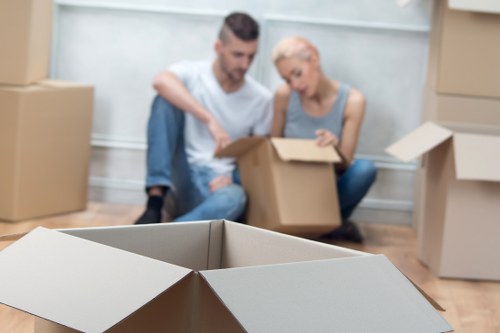 Business removal team assisting a West Hampstead office move with furniture