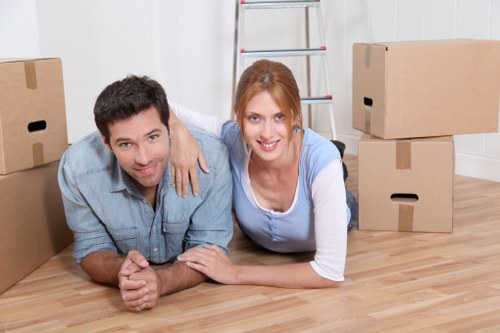 Unpacking boxes and arranging items in a West Hampstead property