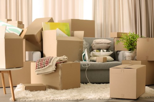 Professional movers carrying furniture through a residential property