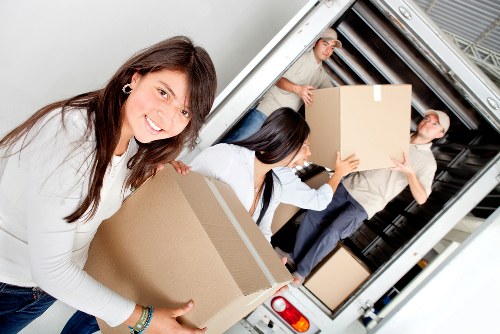 Furniture and boxes being moved from a West Hampstead apartment